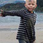 Angus Beaton (5), at Akaroa Beach on Saturday after receiving good news about his condition  from...