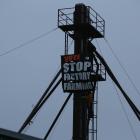 Animal activist Carl Scott scaled a silo at a Dunedin pig farm this morning to protest factory...
