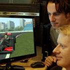 Animation Research's Stu Smith (front) and Ben Sharp do final checks on graphics the company is...