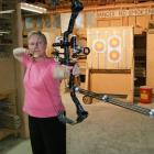 Balclutha archer Anne Mitchell gets in some last-minute practice at work before leaving to attend...