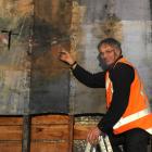 Architectural conservator Guy Williams looks at the finer detail of a 100-year-old, Japanese...