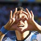 Argentina's Angel Di Maria celebrates scoring against Switzerland during extra time in their 2014...