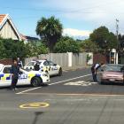 Armed police at the intersection of  Eglinton and Neidpath Roads in Mornington. Photo by Hamish...