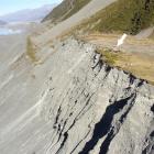 The moraine wall of the receding Tasman Glacier, with the Ball Shelter perched near the moraine...