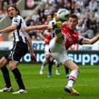 Arsenal's Lourent Koscielny (R) shoots to score against Newcastle United during their English...