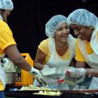 Arshana Sritharan (20), of Hamilton, cook kottu at the festival. Photos by Peter McIntosh.