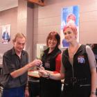 Arthur Bungard hands the keys of Cromwell Beauty Centre to new owners Nik Wilkinson (left) and...