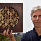 Artist Bruce Mahalski in Dunedin yesterday with his work Possum box number two made from 45...