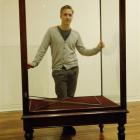 Artist Dane Mitchell with an empty vitrine at the Dunedin Public Art Gallery as he prepares for...