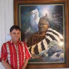 Artist Peter Jean Caley stands beside one of his paintings on display in Waimate this month....