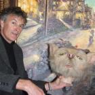 ArtSouth gallery director Bob Martin stands in front of one of the 'Lonely Dog' limited-edition...