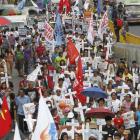 At a rally in Manila last month, protesters display placards and crosses bearing the names of...