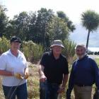 At a working bee to clear willow and broom on Saturday are, from left, chairman Peter Gibson,...