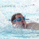 August Landrebe competes in the 50m freestyle. Photo by Craig Baxter.