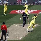 Australia's Mitchell Starc (right) celebrates after bowling New Zealand captain Brendon McCullum...