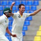 Australia's Trent Copeland (R) celebrates taking the wicket of Sri Lanka's Mahela Jayawardene...