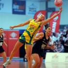 Australia wing defence Renae Hallinan leaps for the ball in front of New Zealand midcourter...