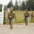 Australian personnel mount a foot patrol from the drop zone through Waimate, to their objective...