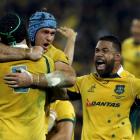 Australian players celebrate a try during their win over South Africa in Brisbane earlier this...