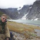Author John Breen sits in front of the terminal lake of the Volta and Therma glaciers. The...