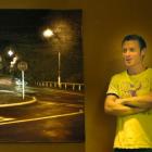 Award-winning artist Sam Foley stands next to his Opoho Intersection No. 1, a kinetic painting...
