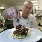Award-winning chef Michael Coughlin adds a garnish to his Silere Alpine Origin Merino spare ribs...
