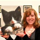 Award-winning photographer Kacy Cosgrove gets by with a little help from her feline friend,...