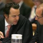 Bain is pictured below talking to a member of his defence team. Photo pool.