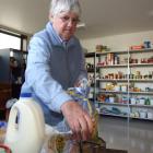 Balclutha Food bank volunteer Ella Kell packs a food parcel for someone in need. Photo by Rachel...