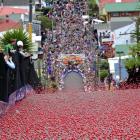 Baldwin St turns red as 25,000 giant Jaffas are sent rolling down the world's steepest street at...