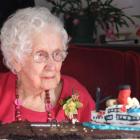 Barbara Lewis inspects her Earnslaw cake at her 100th birthday celebration in Cromwell yesterday....