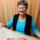 Barbara Rowe with  vintage linen she is selling to raise funds for a foodbank. Photo by Gregor...