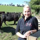 Barbara Schwenk with Angus cattle at the Sanderson family's Fossil Creek stud. Photo by Sally Rae.