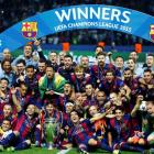 Barcelona players celebrate with the trophy after winning the Champions League final. Photo:...