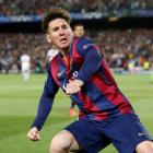Barcelona's Lionel Messi celebrates scoring their first goal against Bayern Munich at the Nou...