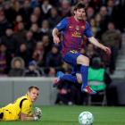 Barcelona's Lionel Messi (R) scores his fourth goal past Bayer Leverkusen's goalkeeper Bernd Leno...