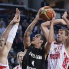 New Zealand's Lindsay Tait looks for a way past the Russia defence