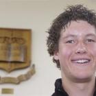 Bayfield High School head boy Jeff Notman (17), in front of the school's crest and motto. Photo...