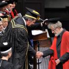 Below, University of Otago chancellor John Ward congratulates Emeritus Prof Jim Flynn on his...