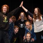 Ben Duff (18) high-fives JJ Thompson (16), with other members of the Bail on Bullying group at...