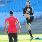 Ben Smith leaps high to catch the ball while Israel Dagg watches during an All Blacks training...