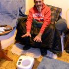 Beneficiary Paul Nolly tries to keep warm in his rental property last night. Photo by Linda...
