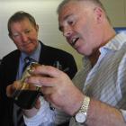 Beta Antifreeze director Geoff Crosswell shows Environment Minister Nick Smith how the antifreeze...