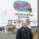 Bill Feather with the sign in 2011. Photo by the ODT.