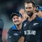 Black Caps coach Mike Hesson (left) embraces Grant Elliott after the semifinal. Photo / NZ Herald