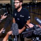 Daniel Vettori talks to the media at Auckland International Airport. Photo / Dean Purcell