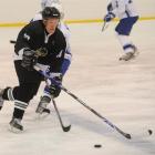 Black Stick Hayden Argyle gets around Greece's Dimitrios Kalyvas during the third division world...