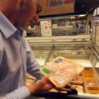 Blair Smith checks product at a Mayfull retail store selling New Zealand beef in Taiwan. Photo...