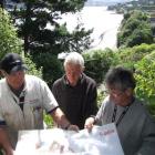 Blueprint: Discussing an old map showing the paper road to be reinstated as a walkway to Company...