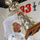 BMW Oracle Racing CEO Russell Coutts raises the trophy after winning the 33rd America's Cup...
